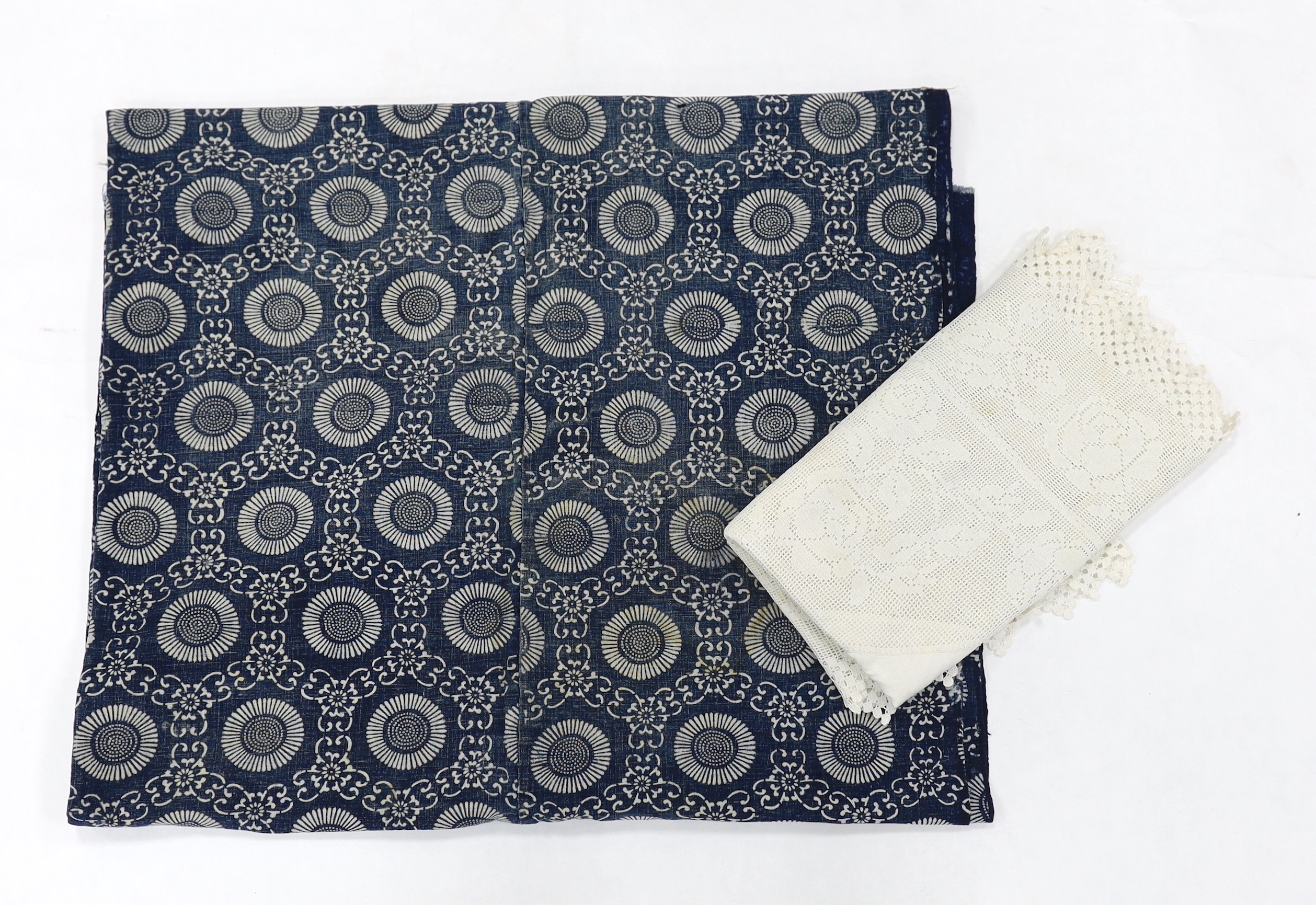 A tablecloth with a wide crocheted border and a blue and white Japanese panel decorated with mons, Japanese fabric 215cm long x 138cm wide (2)